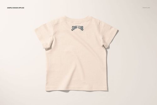 PSD mockup of a short-sleeve infant t-shirt in soft beige, shown from the rear with a subtle graphic on the upper back.