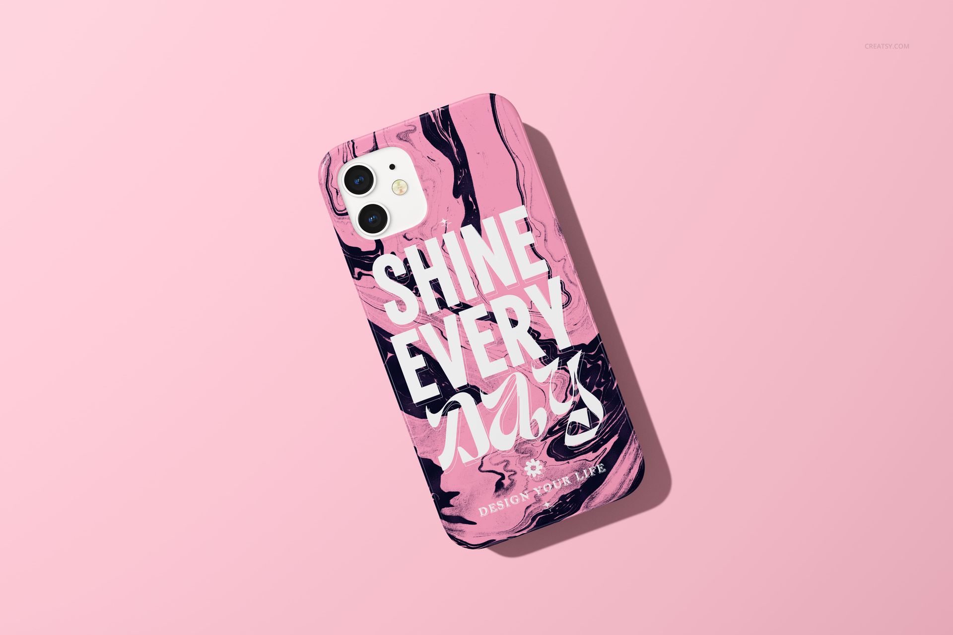 iPhone 12 case mockup featuring a glossy finish, marble swirl design in pink and black, and large white lettering, top view.