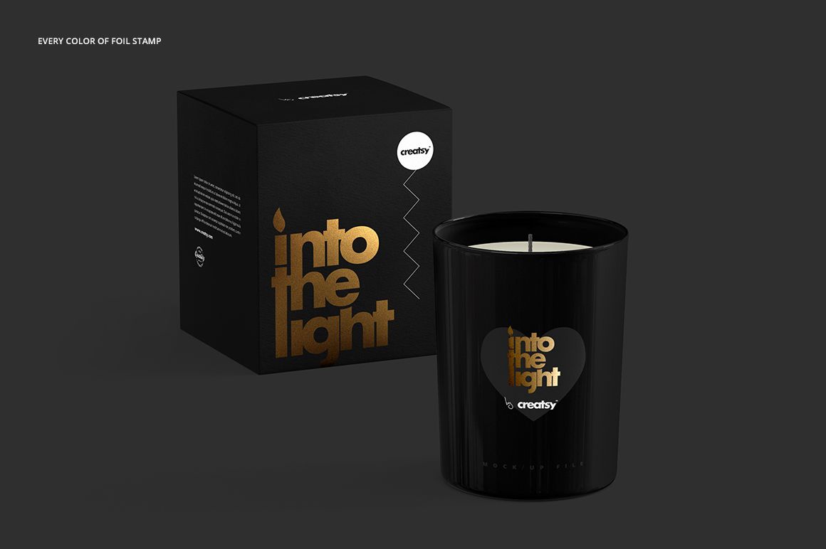 Front-facing view of a candle mockup suite featuring black glass and box, both with metallic gold print accents.