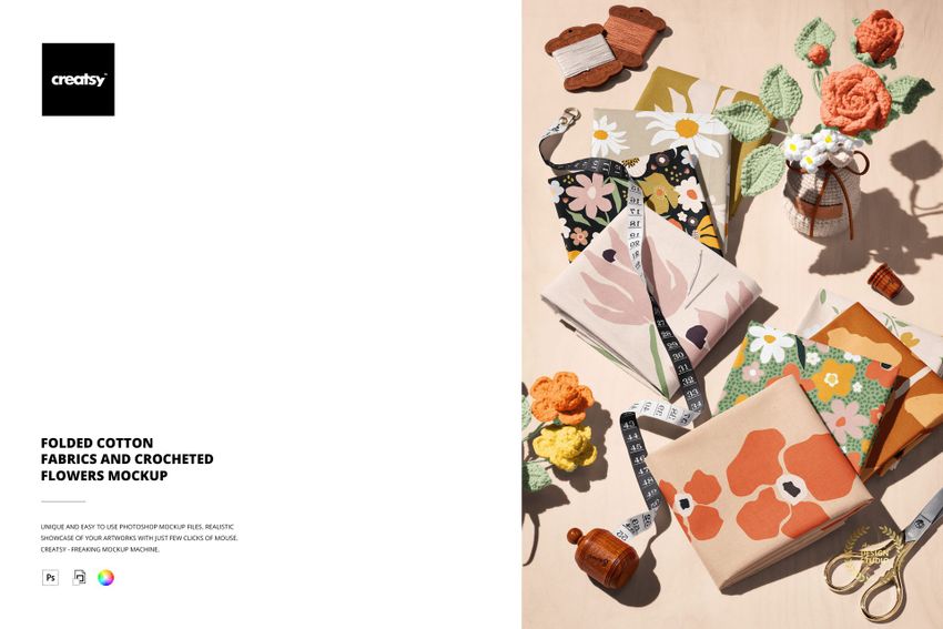 PSD mockup showing colorful cotton fabrics with flower designs, arranged with crochet decorations and craft supplies.