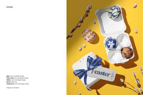 Easter egg mockup set with decorated eggs in white cartons, blue ribbon, and greeting card on a yellow background.