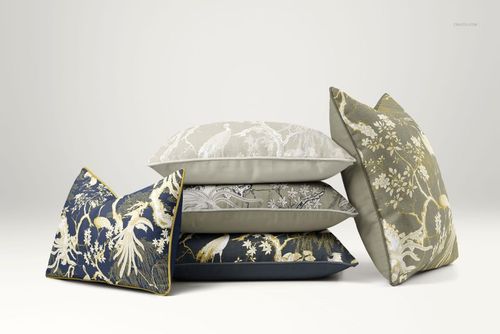 PSD mockup set showing reversible cushions arranged in a row, displaying intricate patterns and varied color palettes.