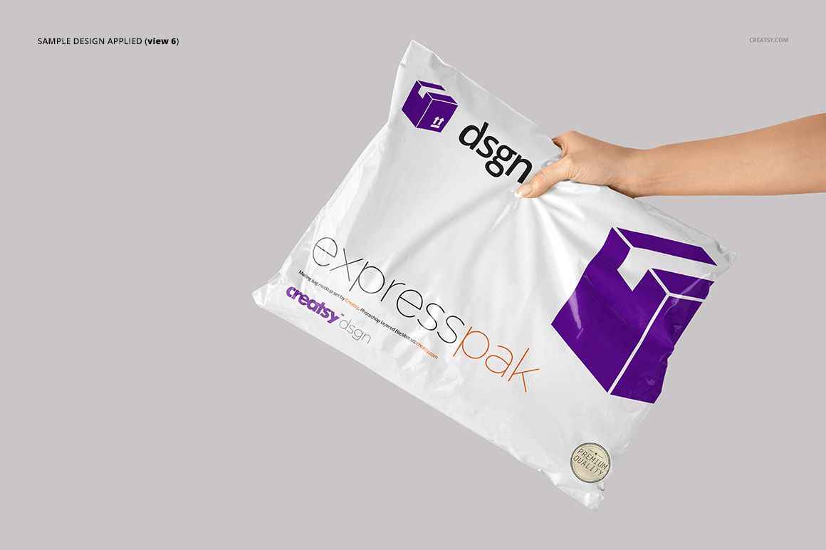 White mailing bag mockup featuring a bold purple box icon and text, held by a hand against a neutral backdrop.