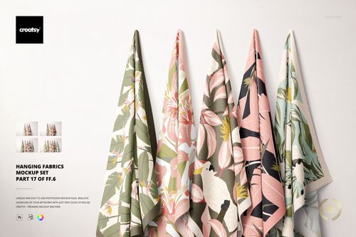 Hanging fabrics mockup set showing various textile designs with leaves and flowers, arranged against a neutral wall.