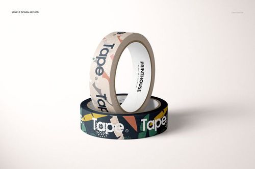 Mockup of paper packing tape rolls, one in beige and one in black, both with graphic patterns, shown in a minimalist scene.