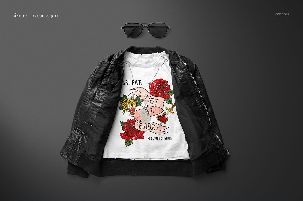 Kids t-shirt mockup featuring a white shirt with a vibrant print, styled with a black jacket and sunglasses.