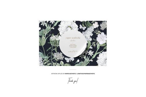 Mockup of a rectangular cushion with tassels, displaying a botanical print with white blooms and foliage, front perspective.