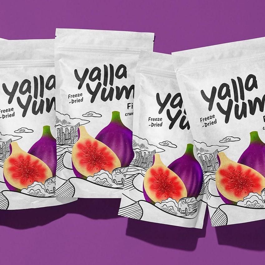 Stand up paper pouch mockup featuring four white pouches with fig illustrations and bold black text on a purple background.