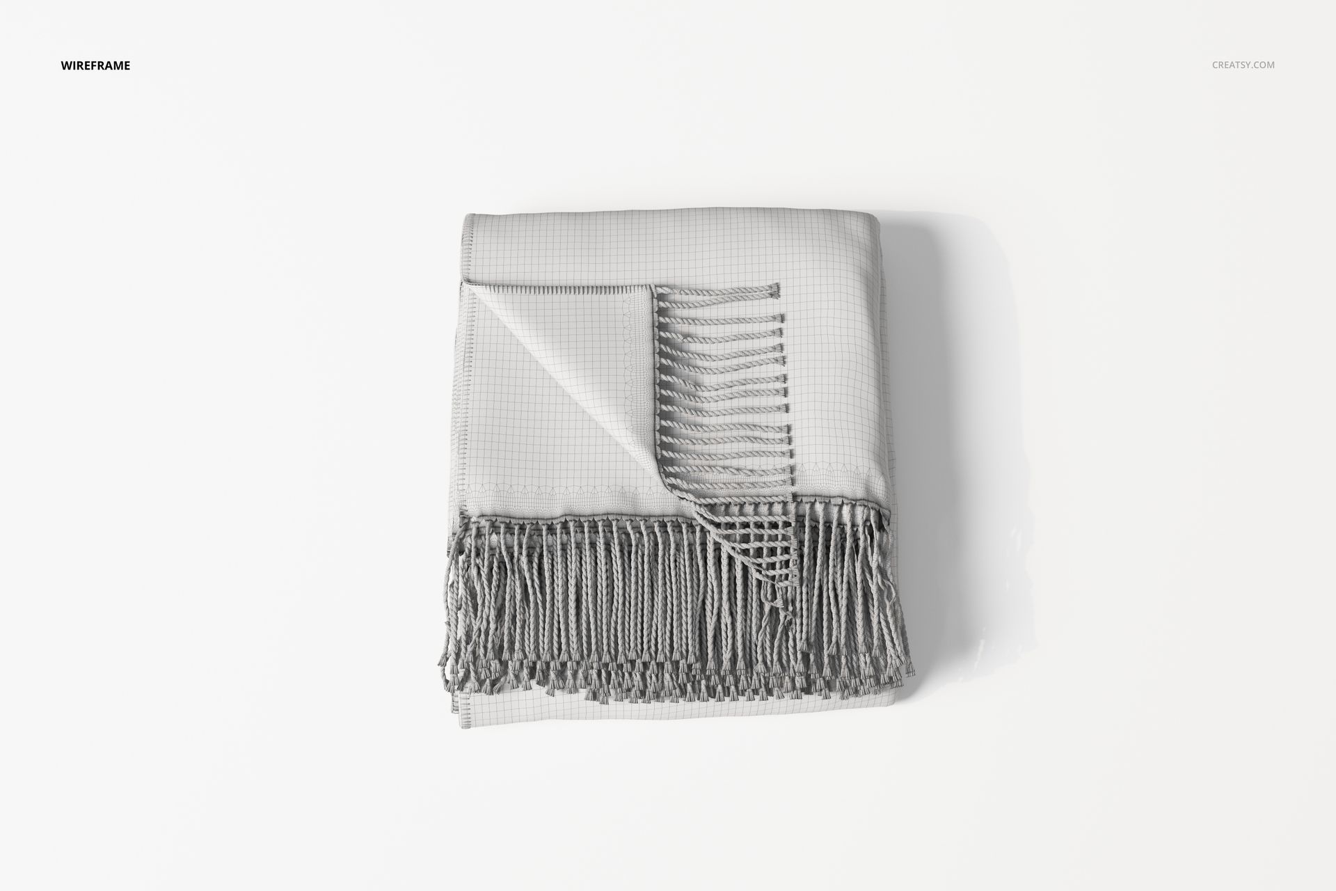 Folded fringe blanket in light gray with a wrapped corner, viewed from above on a plain white background.