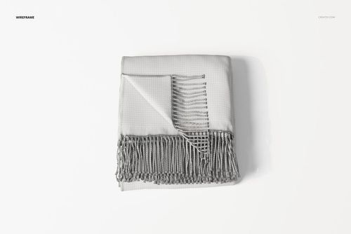 Folded fringe blanket in light gray with a wrapped corner, viewed from above on a plain white background.