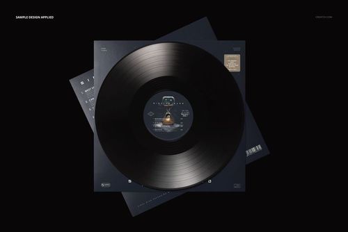 PSD mockup showing a black vinyl record and two dark album covers arranged with a flat lay perspective.