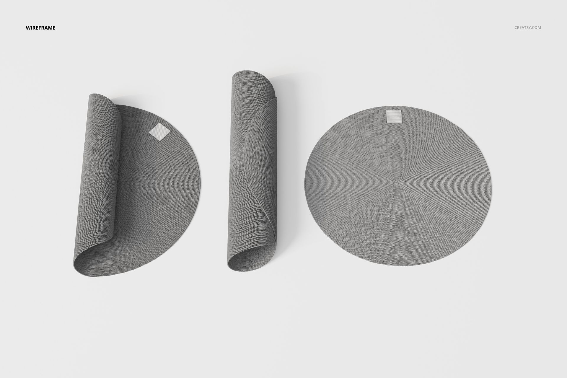 Top view of three round braided rugs in gray, two partially rolled and one flat, arranged on a white background.