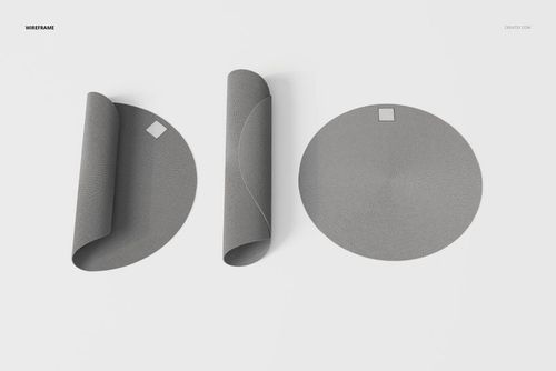 Top view of three round braided rugs in gray, two partially rolled and one flat, arranged on a white background.