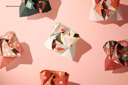 Origami rose-shaped stationery mockups arranged on a pink background, featuring various colorful floral patterns.