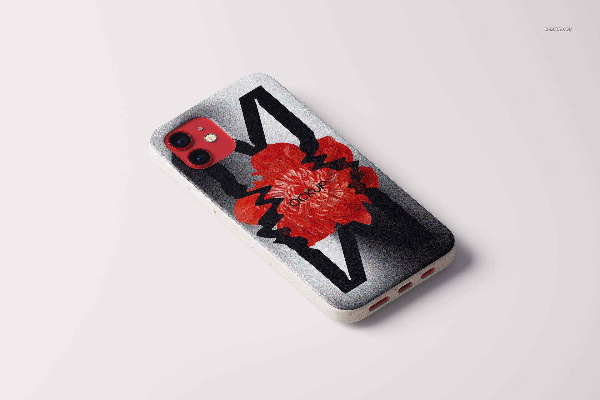 PSD mockup of an iPhone 12 eco case featuring a large red floral design and graphic black accents, angled view.