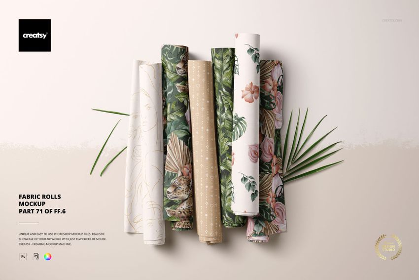 Front view of multiple patterned fabric rolls in various shades, shown in a PSD mockup scene with natural accents.