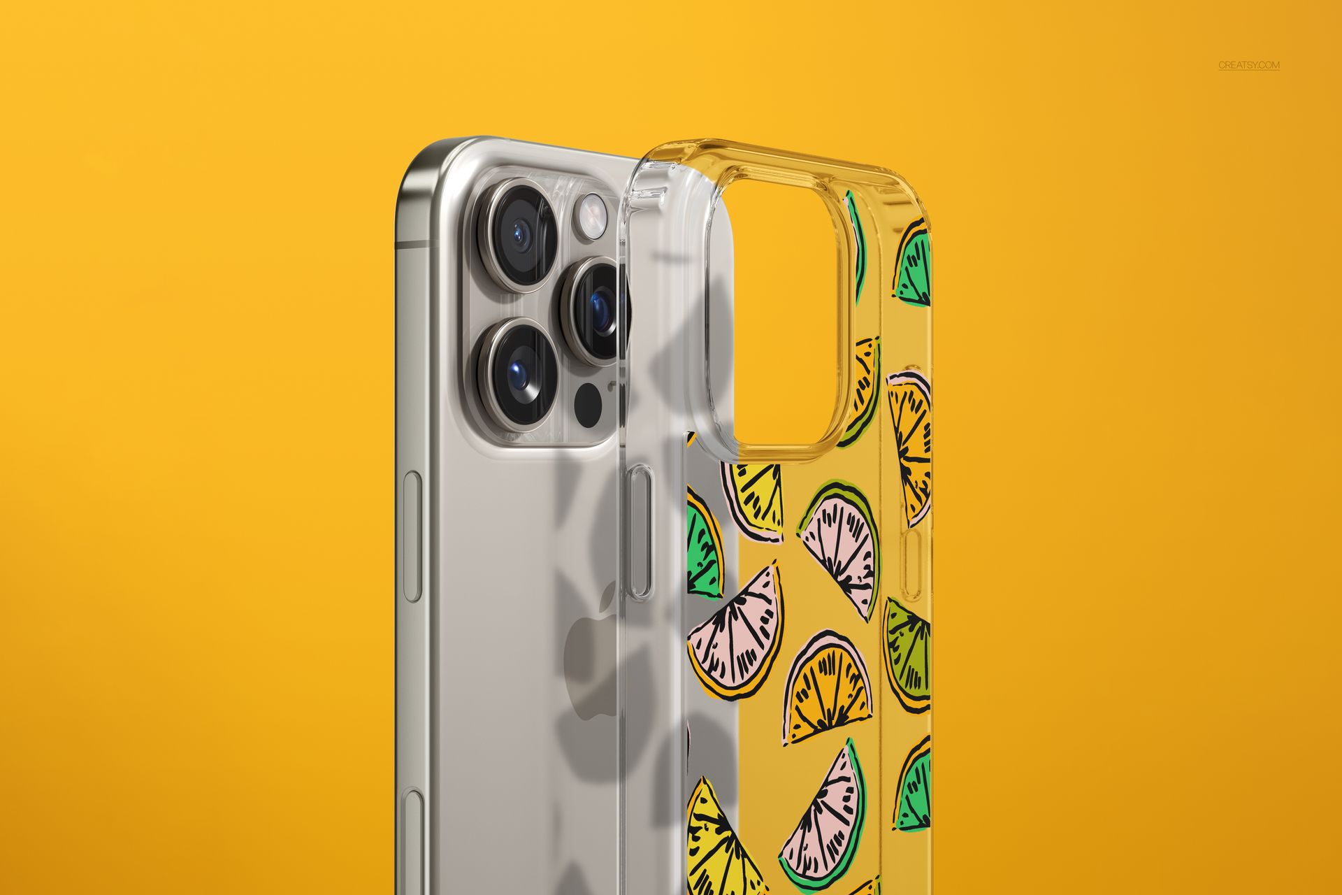 Clear phone case mockup for iPhone 16 Pro Max shown from a close-up angle with citrus slice pattern on yellow background.