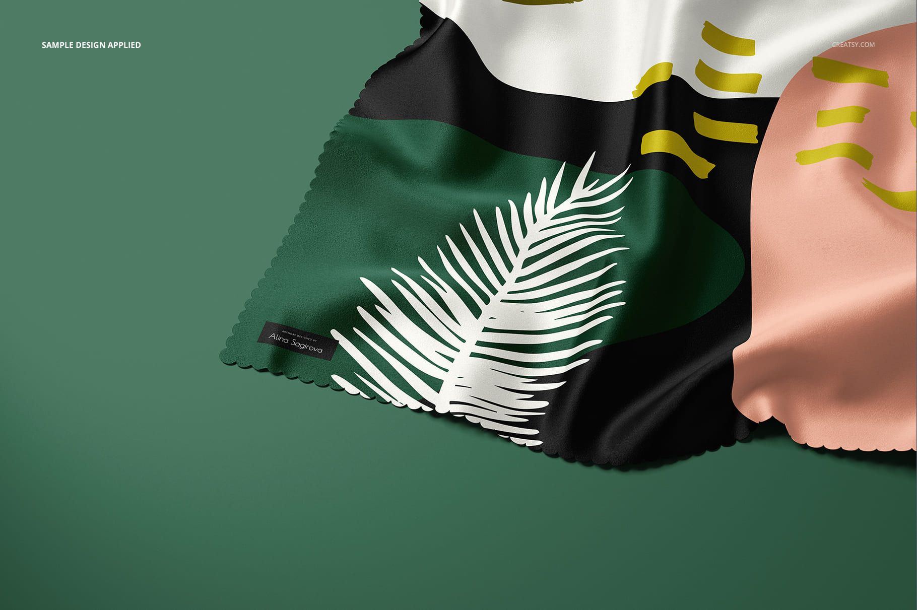 Laser cut silk fabric mockup featuring a close-up of patterned textile with green, black, pink, and white colors.