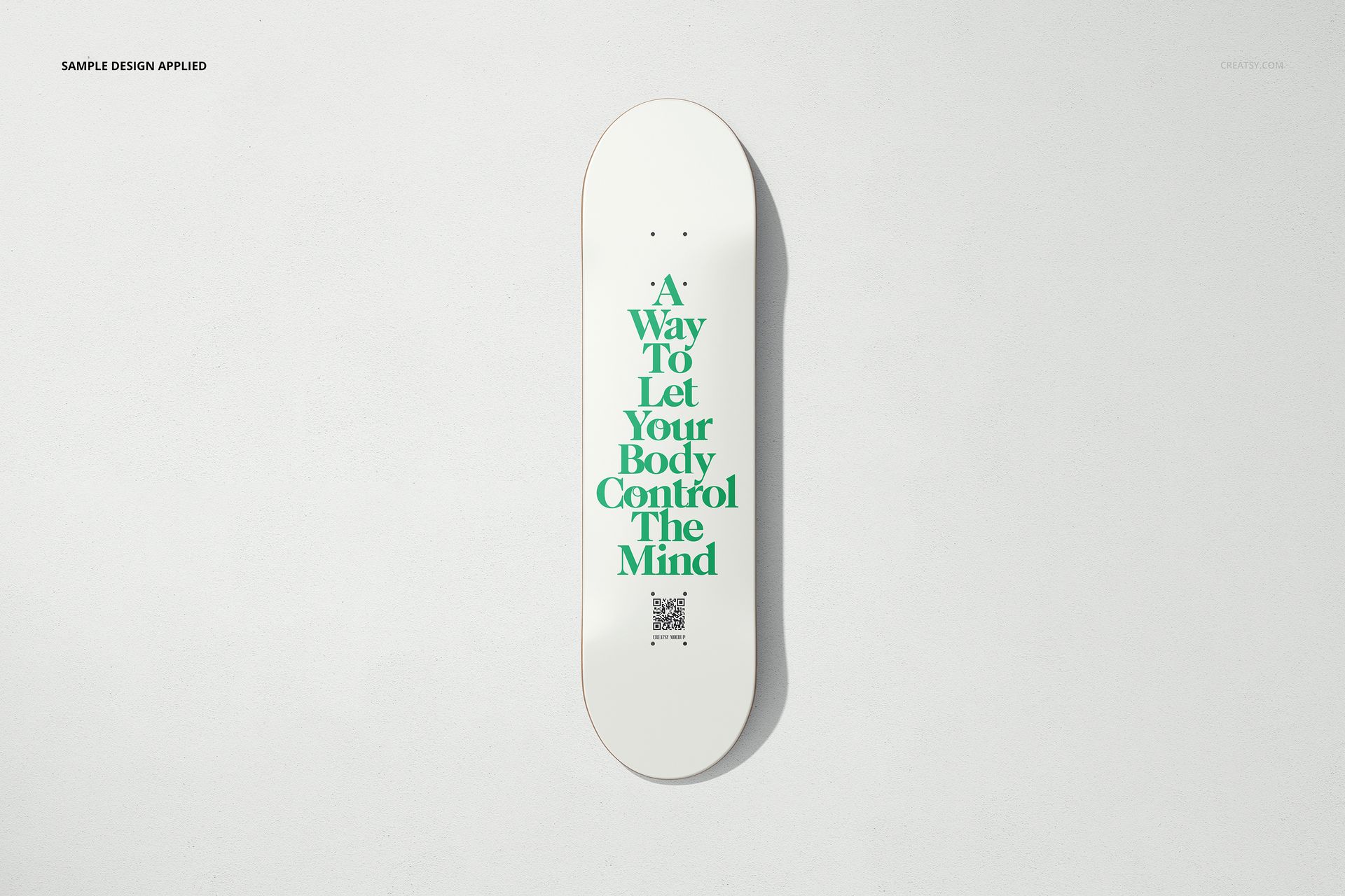 Skateboard deck mockup featuring a white board and bold green typography, shown from above on a neutral surface.