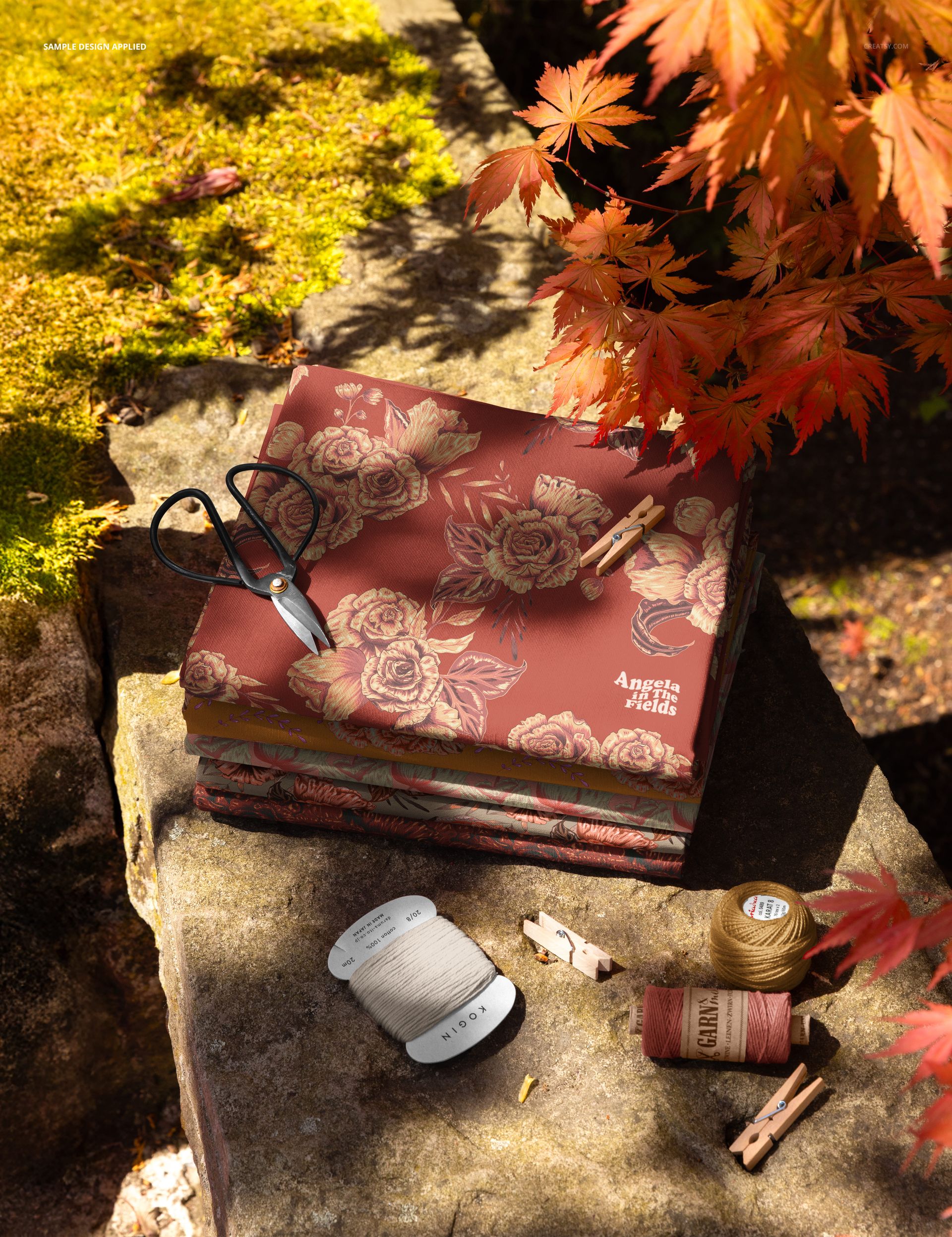 Fabric Swatches on a Stone Ledge in a Fall Setting Mockup - mockup screenshot 4