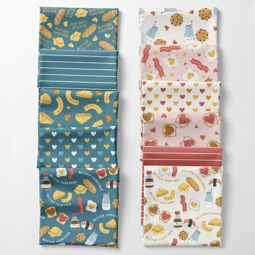 Folded fabrics mockup featuring colorful fabric pieces with playful food patterns and text overlays, arranged in two neat stacks.