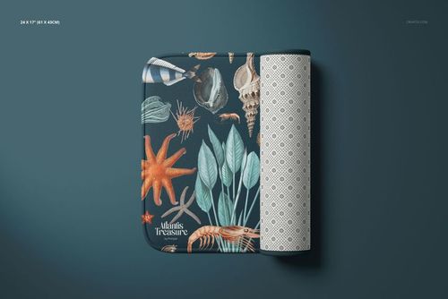 Microfiber bath rug mockup displayed folded, showing oceanic designs and a geometric underside on a blue surface.