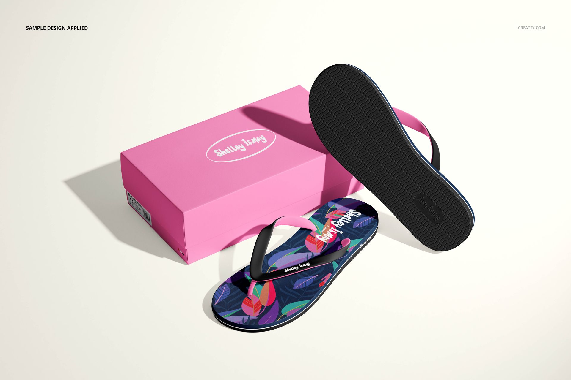 Flip flops mockup set featuring vibrant patterned sandals and a matching pink shoe box, displayed on a neutral surface.