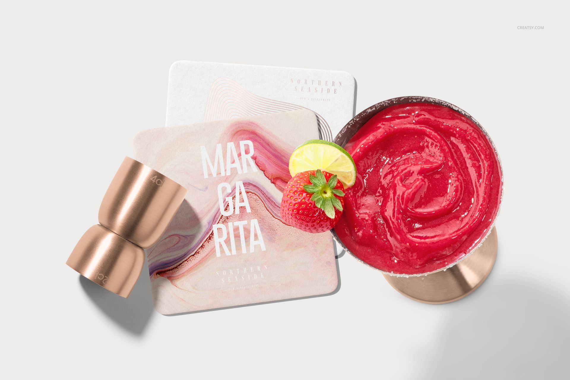 Square coasters mockup set displayed with a margarita cocktail, copper jigger, and fruit garnish on a light background.