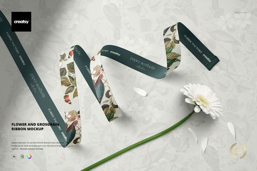 Stylish grosgrain ribbon mockup featuring teal and floral designs, shown in a wavy arrangement beside a daisy.