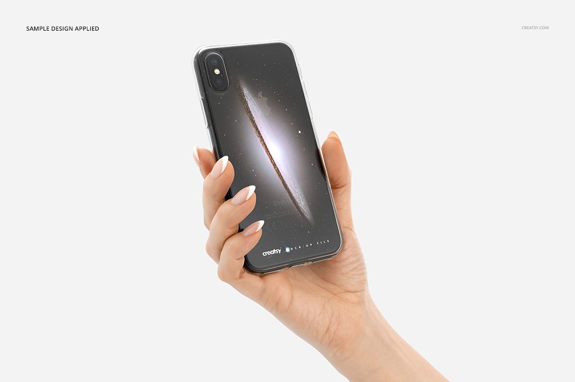 PSD mockup of a black iPhone X in a transparent case with a galaxy illustration, presented against a plain white backdrop.