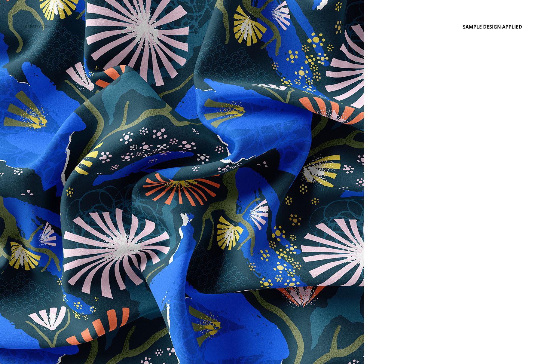 Close-up of silk fabric mockup featuring a colorful abstract floral pattern in blue, pink, and green tones.