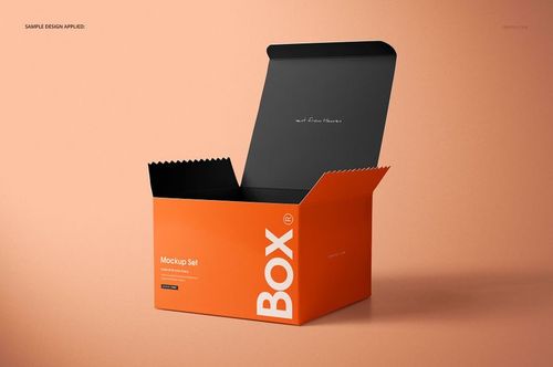 Orange chipboard gift box mockup with open black lid, jagged top edge, and minimal text, displayed on peach background.