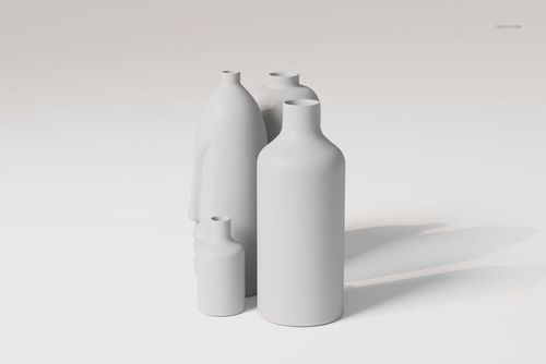 Four minimalist sculptural vases in matte white finish arranged together on a light neutral background, front view.
