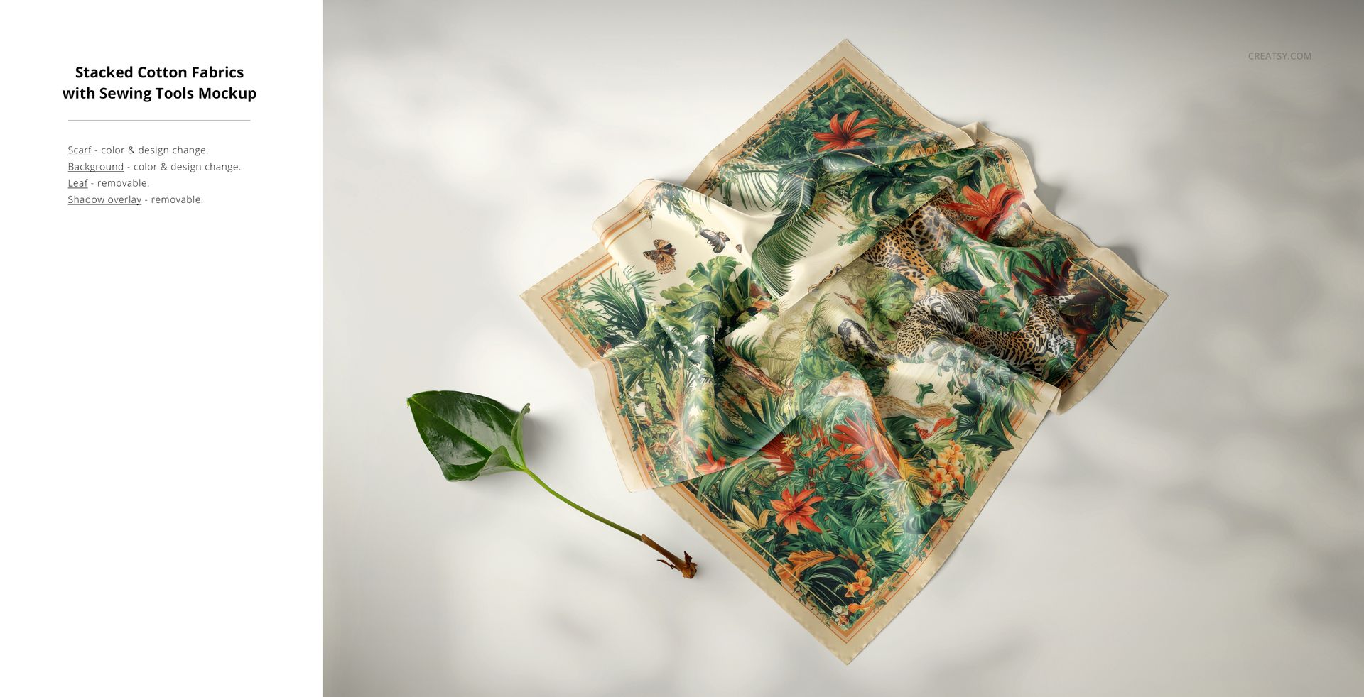 Layered silk fabric mockup featuring vibrant jungle pattern with leaves and animals, displayed on a neutral background.