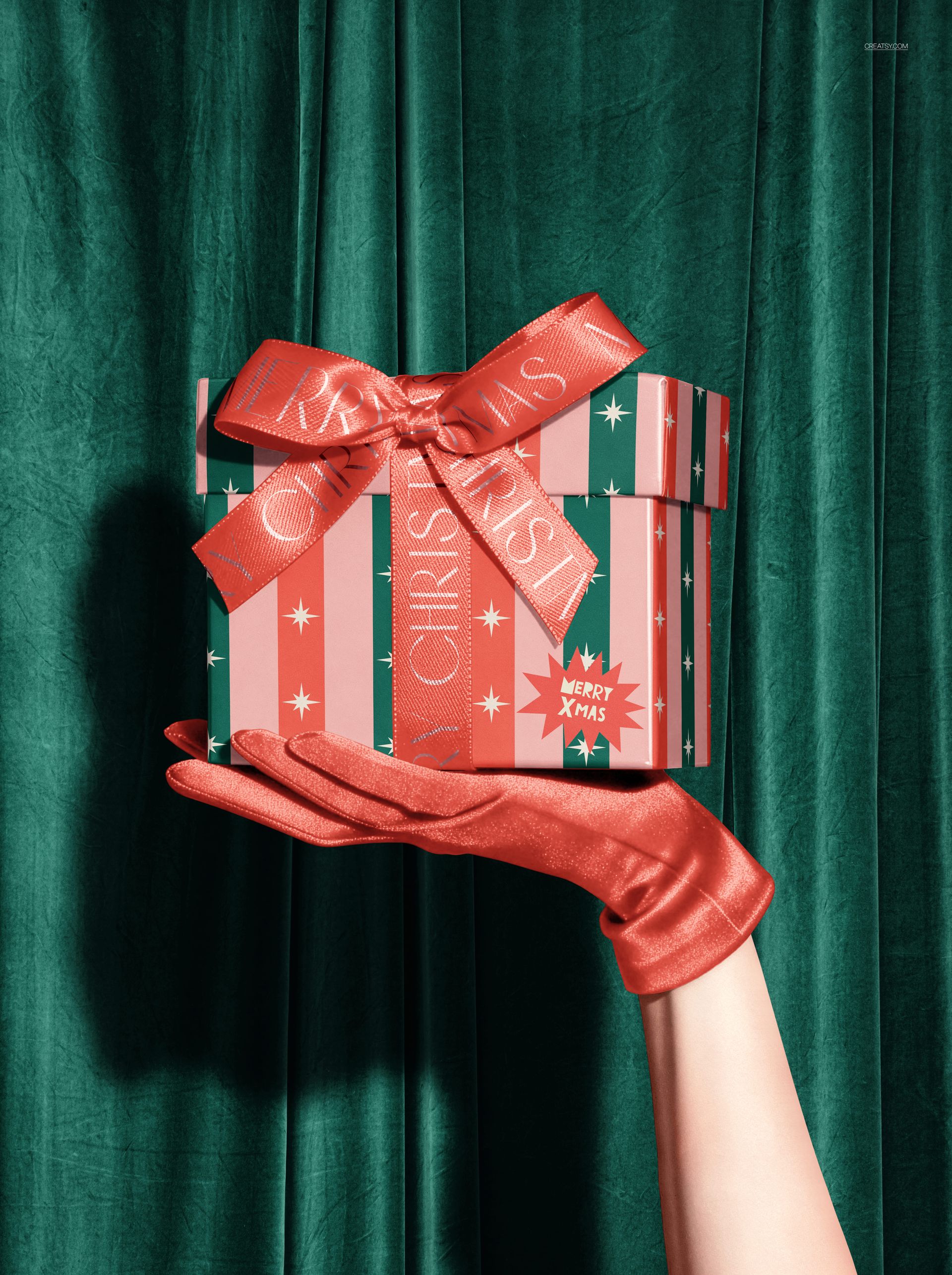 Christmas gift box mockup featuring a red bow, star patterns, and gloved hand, with a velvet curtain background.