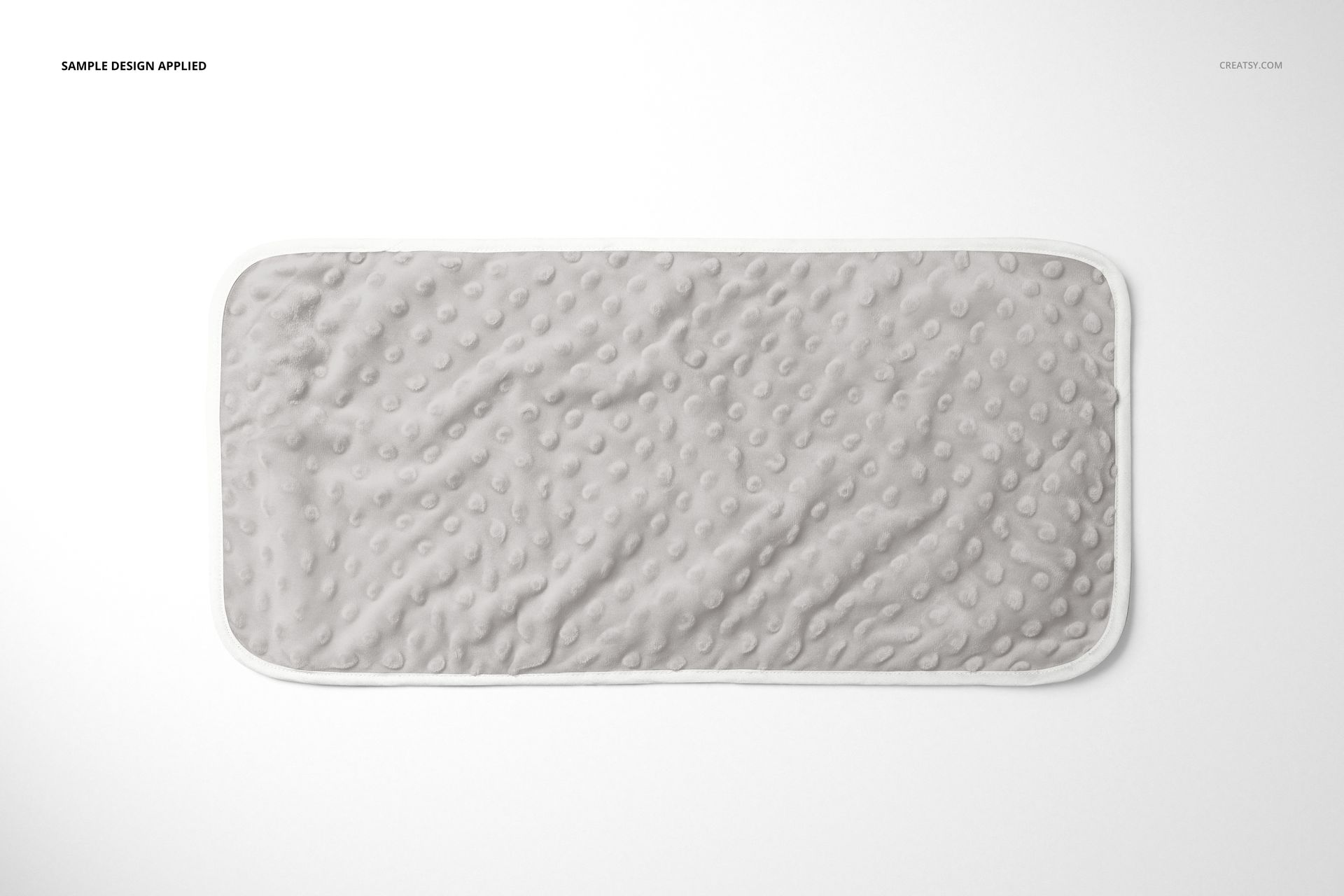 Top view of a minky burp cloth mockup featuring a dimpled texture and rounded corners, displayed flat on white.