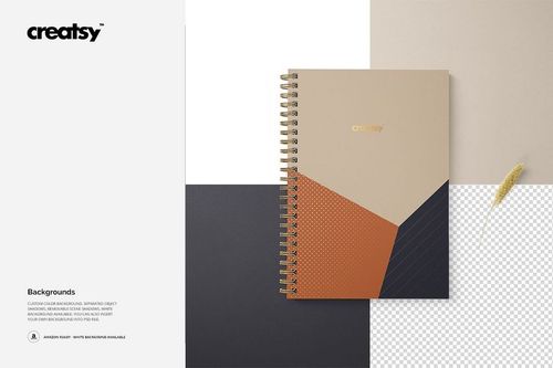 Mockup of an A5 spiral notebook with square corners, geometric cover design, and gold spiral rings on a color-blocked surface.