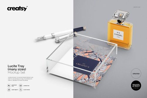 Rectangular clear lucite tray mockup with patterned insert, shown from an angled top view beside perfume and pens.