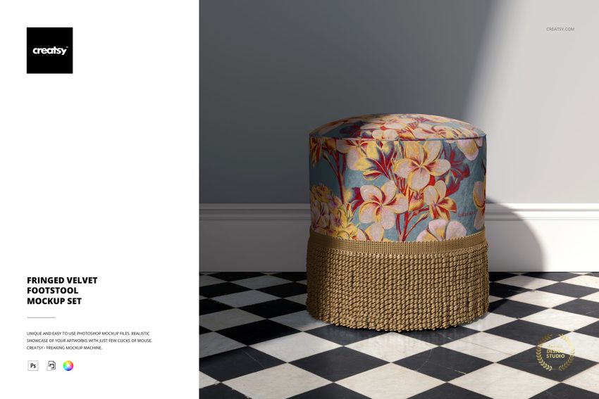 Fringed velvet footstool mockup featuring a colorful flower design and gold fringe, placed on a tiled floor.
