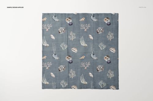 Square cotton linen napkin mockup with a blue background and sea-inspired pattern, shown from a top view on a white surface.