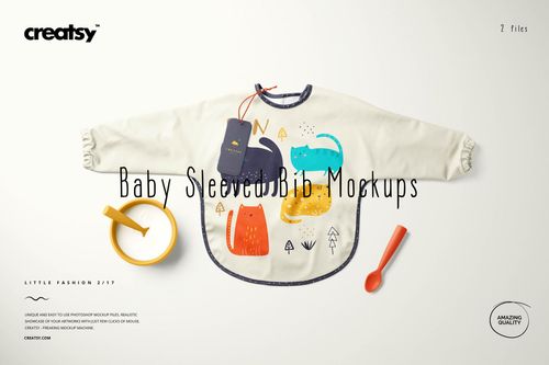 Baby sleeved bib mockup featuring playful animal graphics, shown with a yellow spoon, bowl, and product tag on a neutral surface.