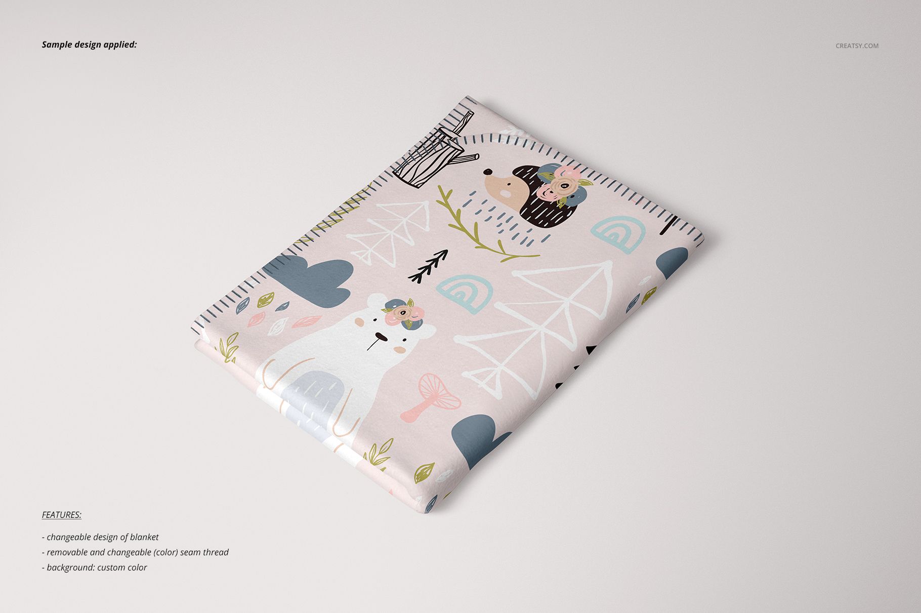 Single layer blanket mockup featuring whimsical animal illustrations and soft colors, displayed on a plain surface.