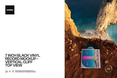 PSD mockup featuring a black vinyl record and vibrant cover set on rugged cliff terrain with ocean in the background.
