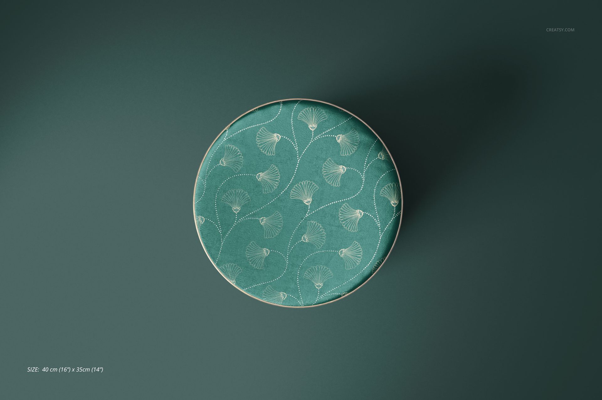 PSD mockup of a round pouf upholstered in green fabric with a delicate leaf motif, displayed from above.