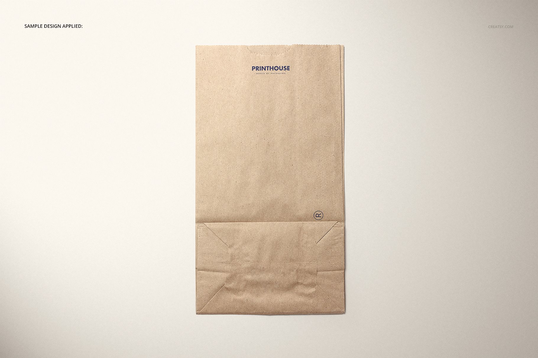 Front view of a kraft paper lunch bag with a simple folded bottom, set on a neutral background, mockup style.