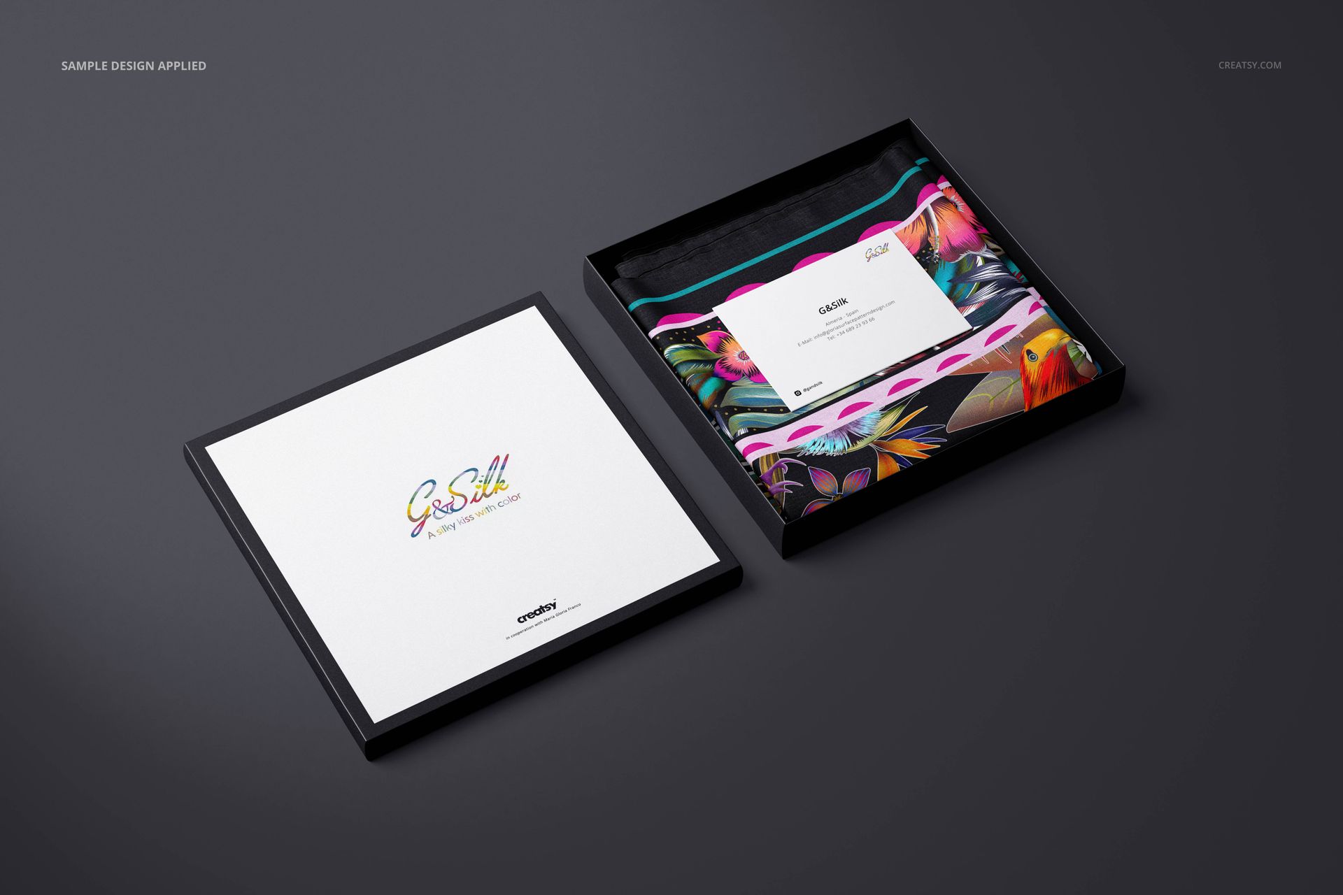 Lightweight cashmere scarf mockup set featuring a folded scarf with colorful design and branded card in a black box.