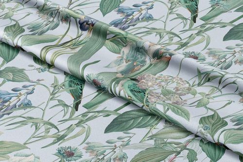 Curtains fabric mockup displaying a nature-inspired design with various leaves and flowers, viewed from above.