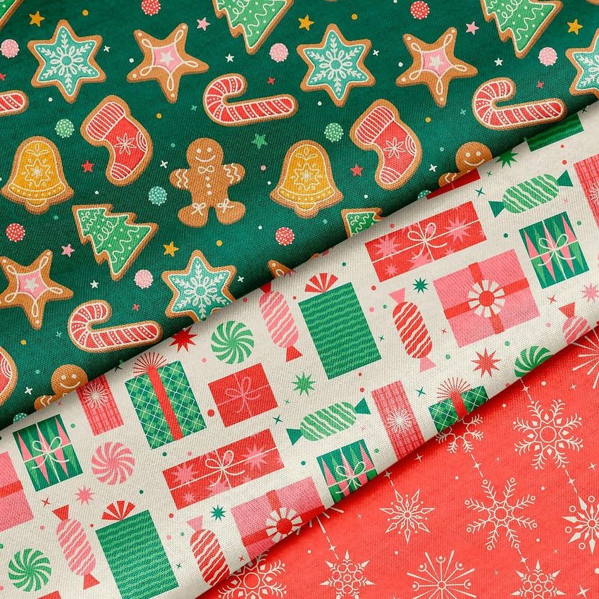 Cotton fabric mockup featuring three folded fabrics with festive holiday patterns, including gifts, cookies, and snowflakes.