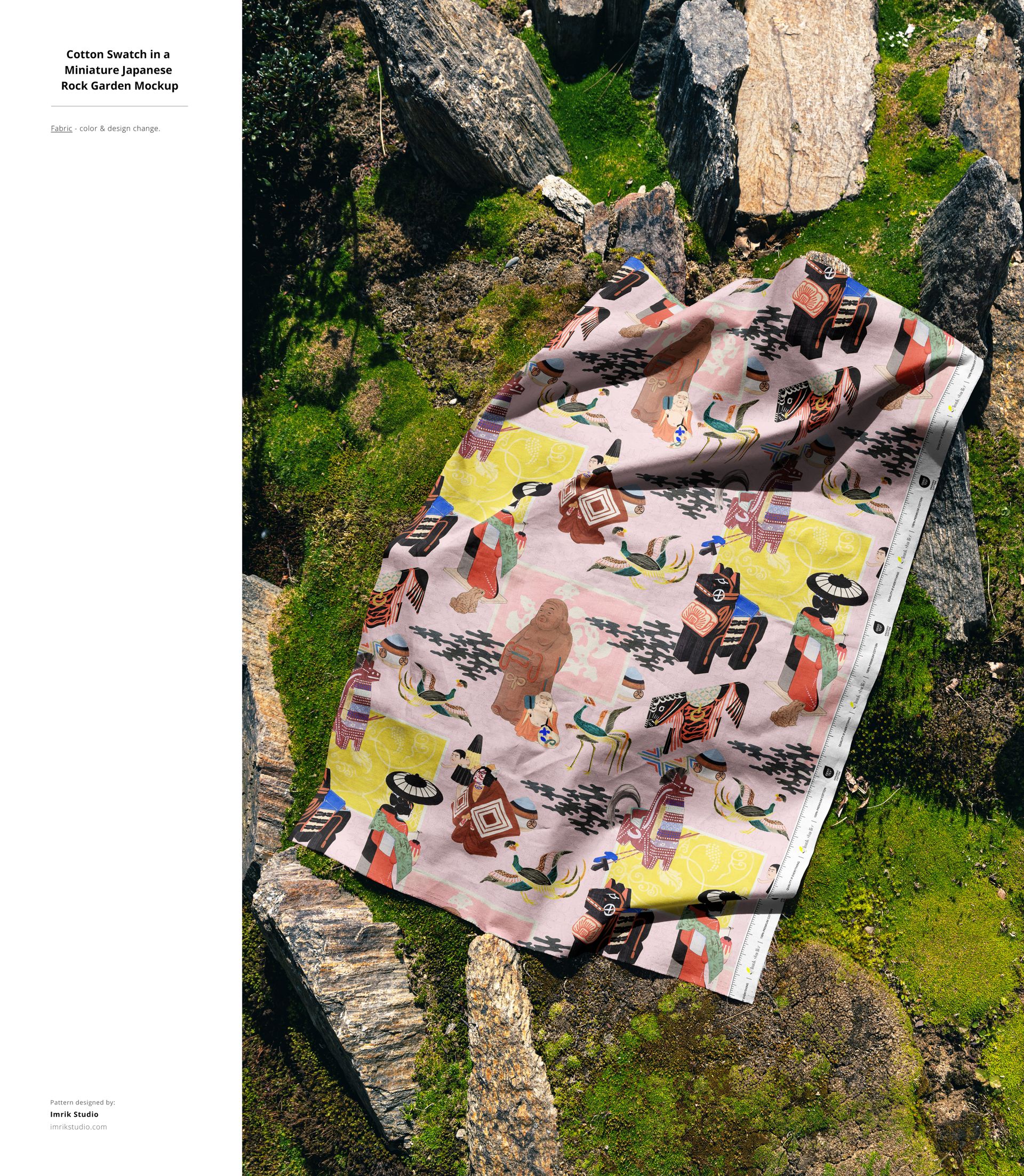 Patterned cotton fabric mockup laid out on green moss and surrounded by natural stone elements, overhead perspective.