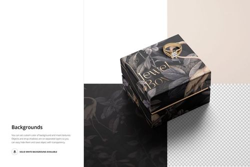 PSD mockup of a square jewelry box featuring a botanical design, gold lettering, and a ring placed on the lid.